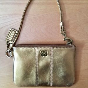Coach gold clutch wristlet